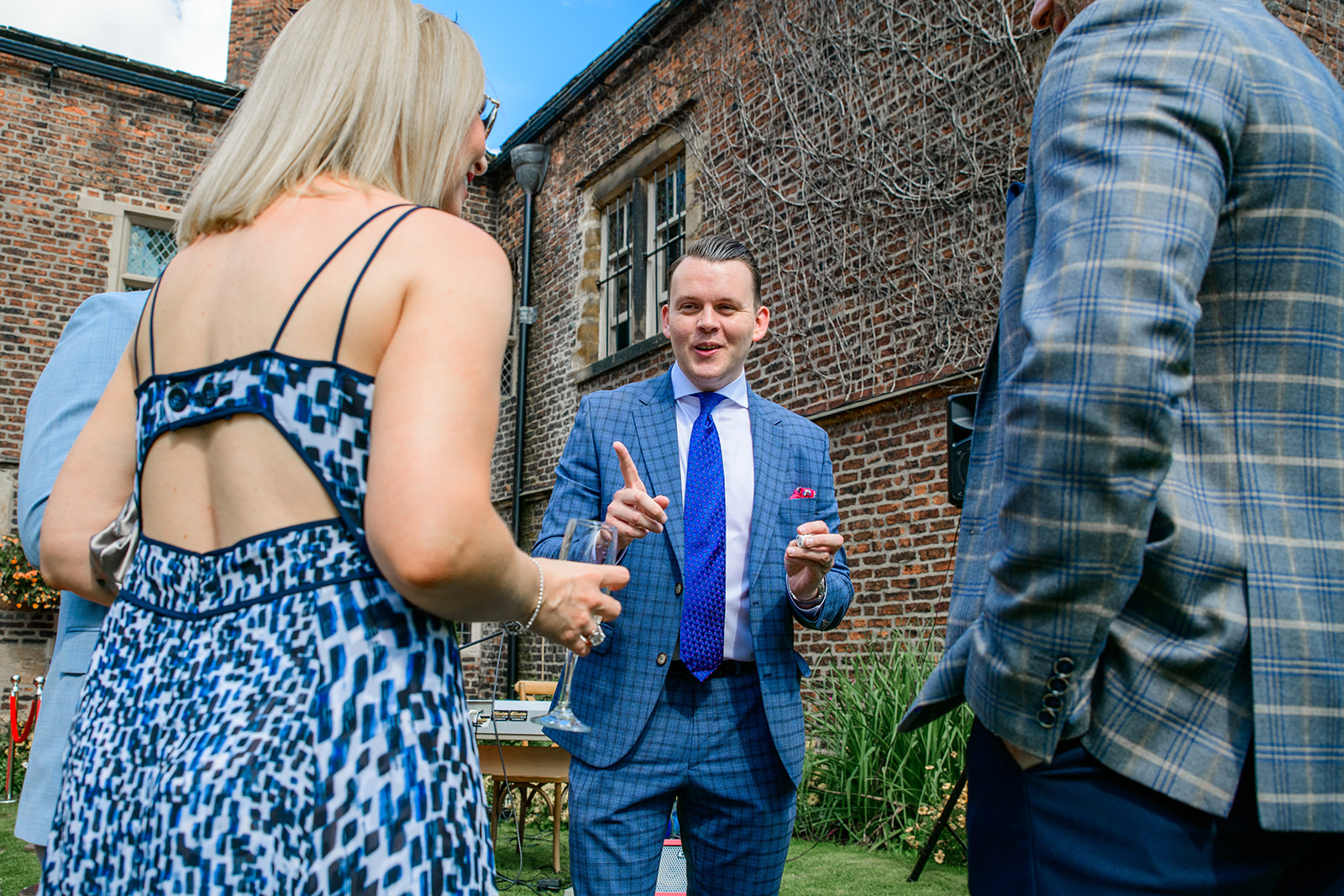 magician entertains guests at a private home marquee wedding