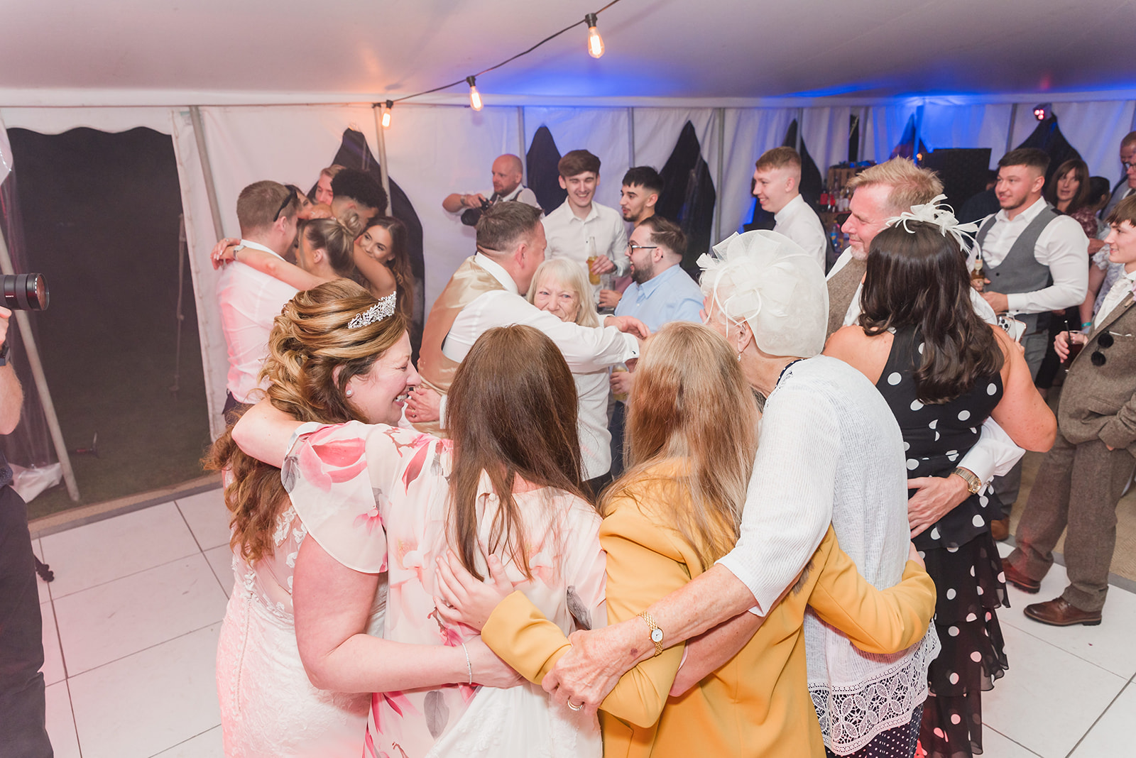 a full dance floor as wedding guests celebrate