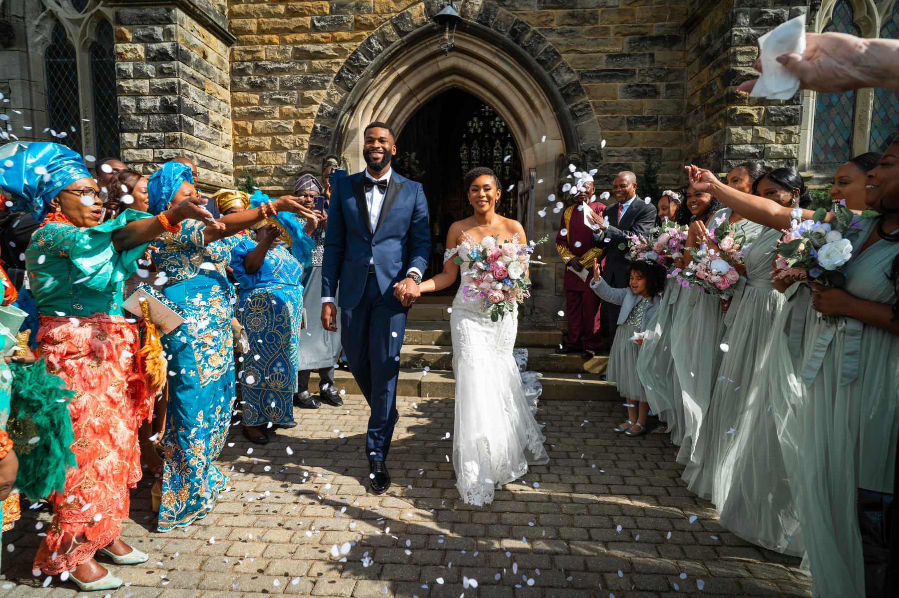bride and groom showered with confetti 